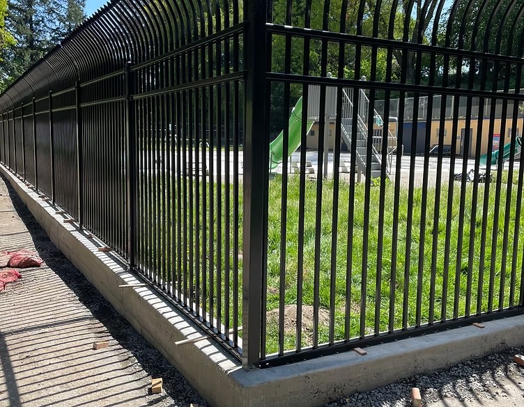 Ornamental metal fence installation