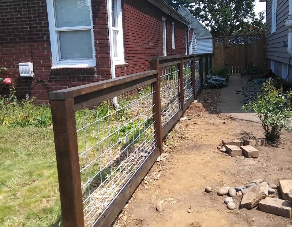 Hog wire fence with wood posts